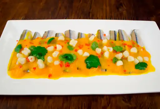 Tiradito al Ají Amarillo con Pejerrey