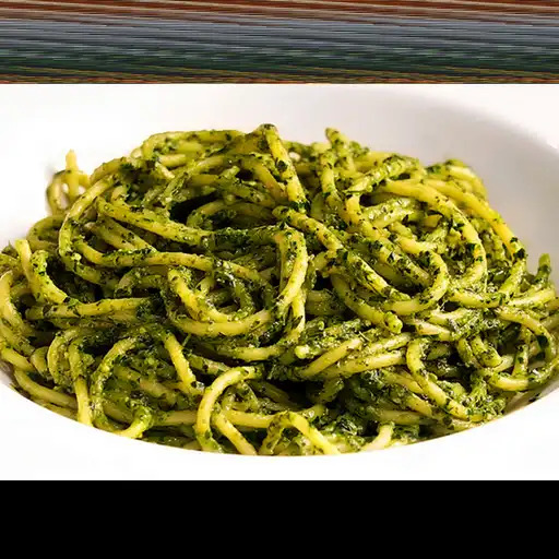 Pasta al pesto clásico con huevo frito
